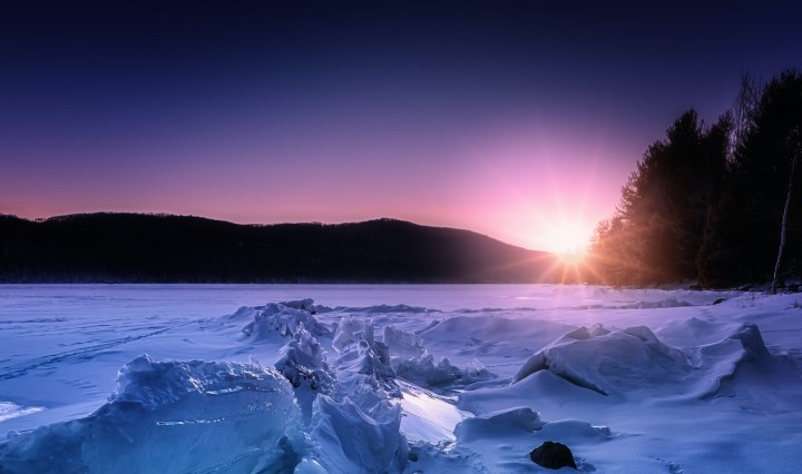 Sunrise over an icy lake