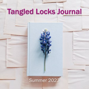 decorative with link. Cover image with the text "Tangled Locks Journal" "Summer 2023"
Image of a white journal with a purple/blue flower resting on the cover.