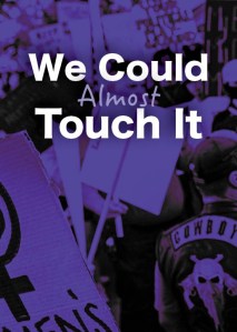 A visually striking image of a protest scene with bold text overlay reading 'We Could Almost Touch It.' The background features various signs, including a feminist symbol and a motorcycle jacket.