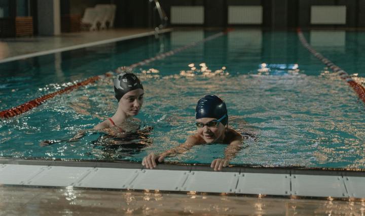 two women practicing in swimming pool