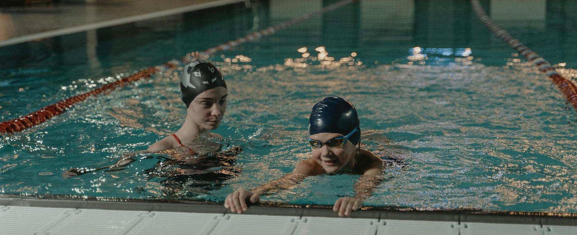 two women practicing in swimming pool